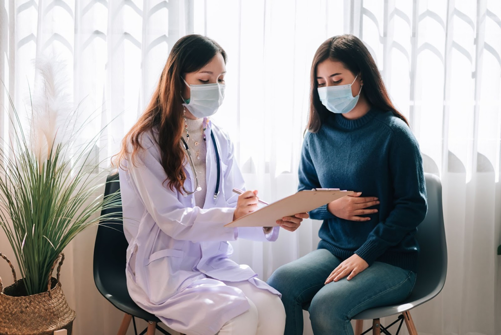 Doctor discussing symptoms and treatment options with a patient during a private consultation