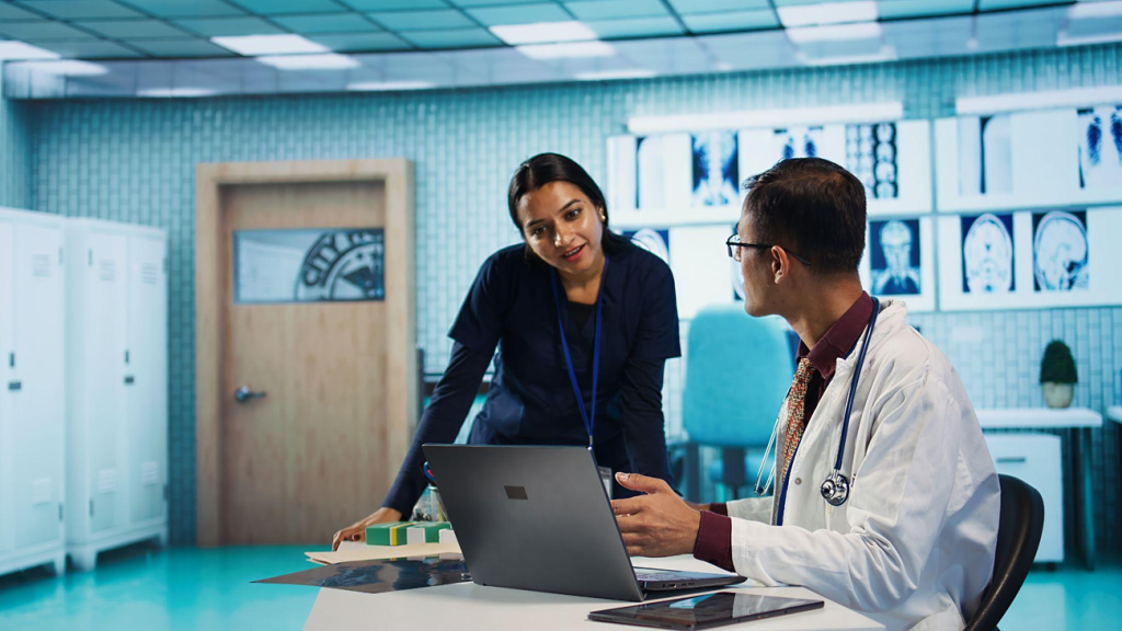 Healthcare professionals collaborating and reviewing patient information in a hospital setting