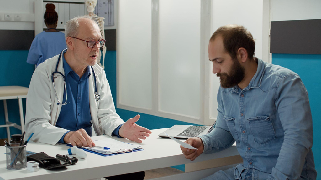 Doctor reviewing medical information and discussing treatment options with a patient.