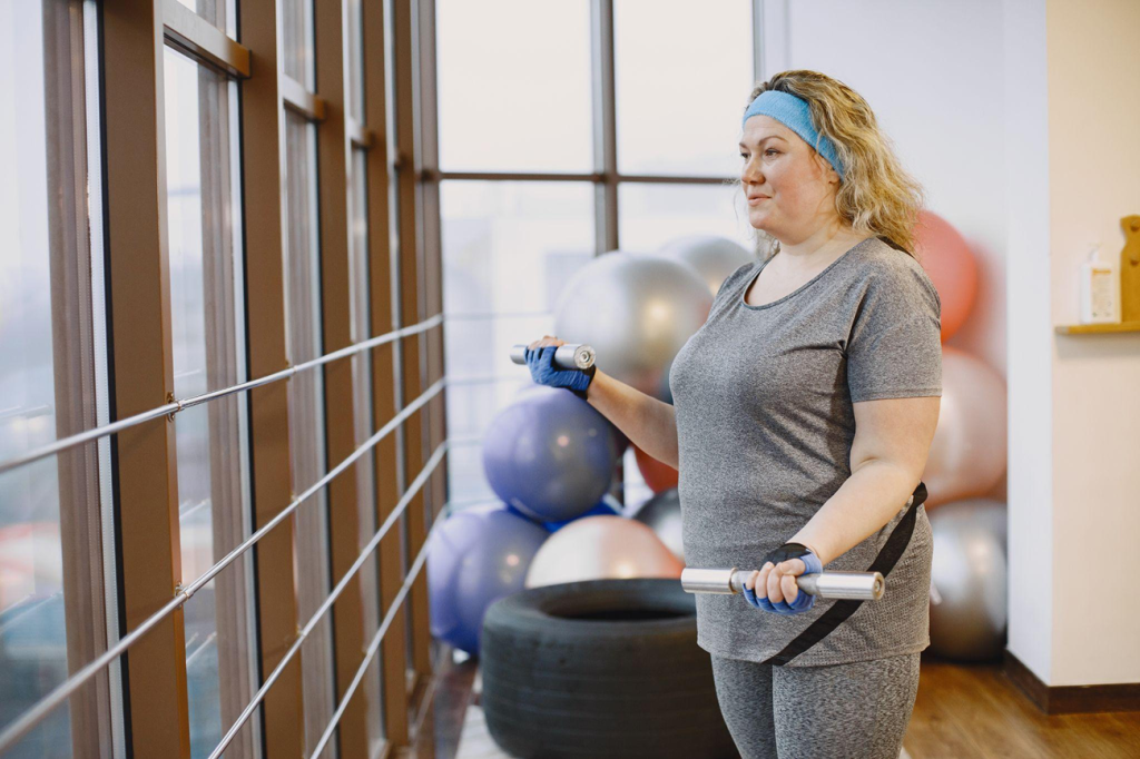 Woman exercising as part of a medically supervised weight loss programme.